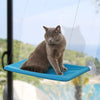 Hamac de Fenêtre Pour Chat en bleu turquoise avec un chat gris assis en équilibre.