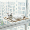 Hamac de Fenêtre Pour Chat en beige avec un chat blanc allongé face à la vitre.