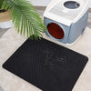 Tapis de Litière pour Chat - Tapis noir placé devant une maison de toilette pour récupérer les grains.