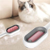 Brosse Pour Poils De Chat efficace sur meubles et tissus, avec tête texturée rose anti-poils.